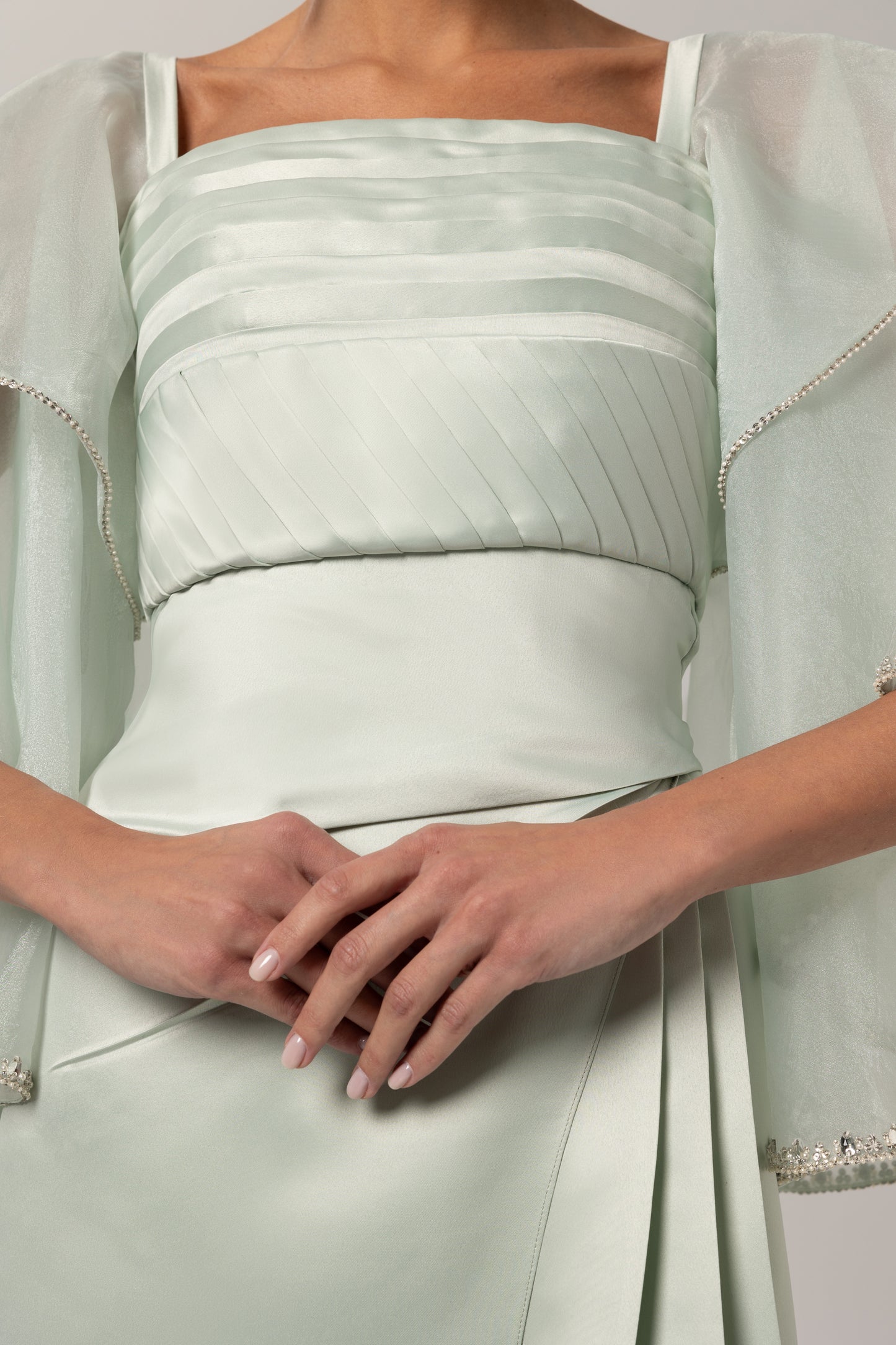 Hand-pleated bodice with sheer sleeves