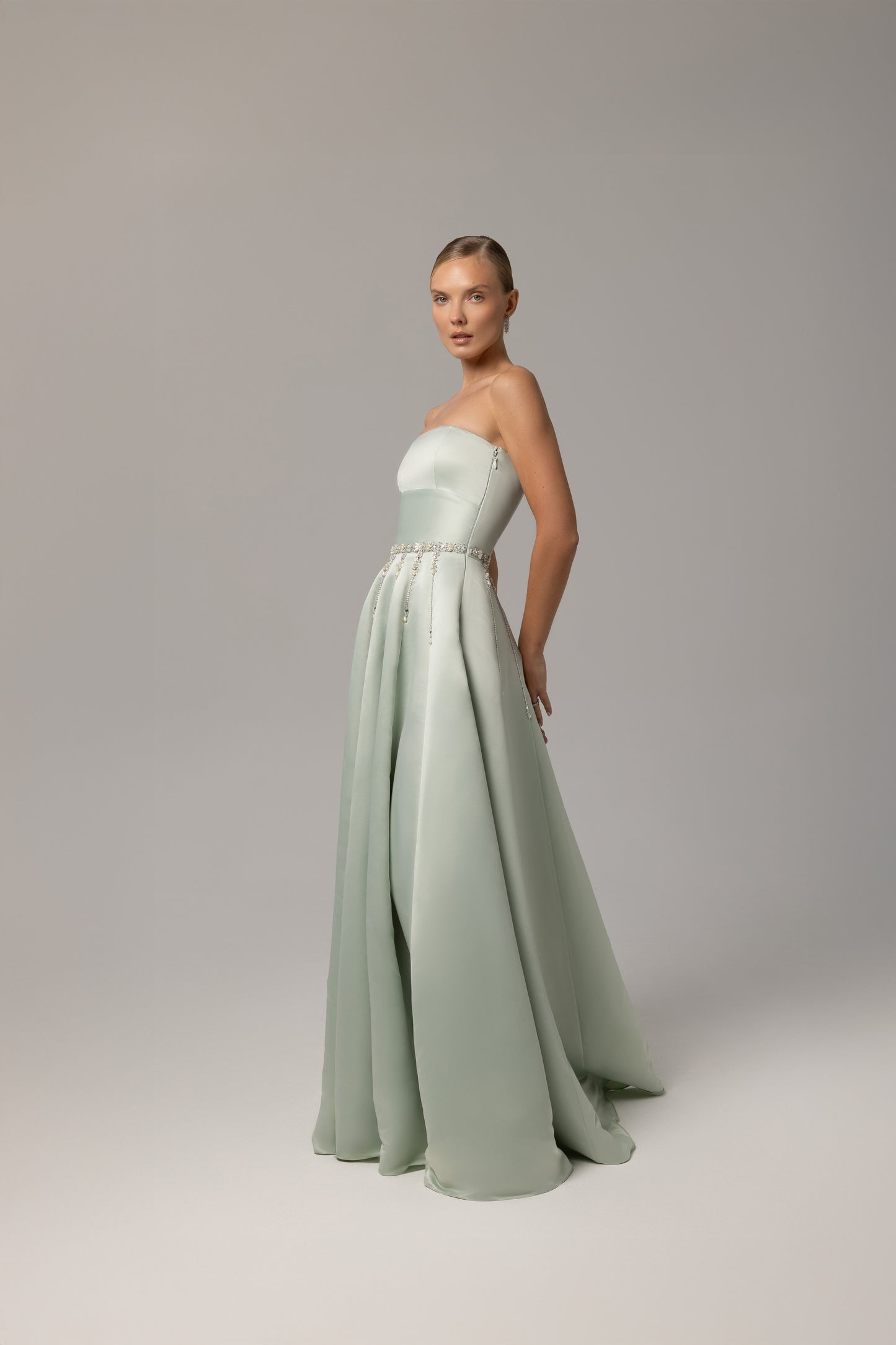 Strapless satin gown with crystals